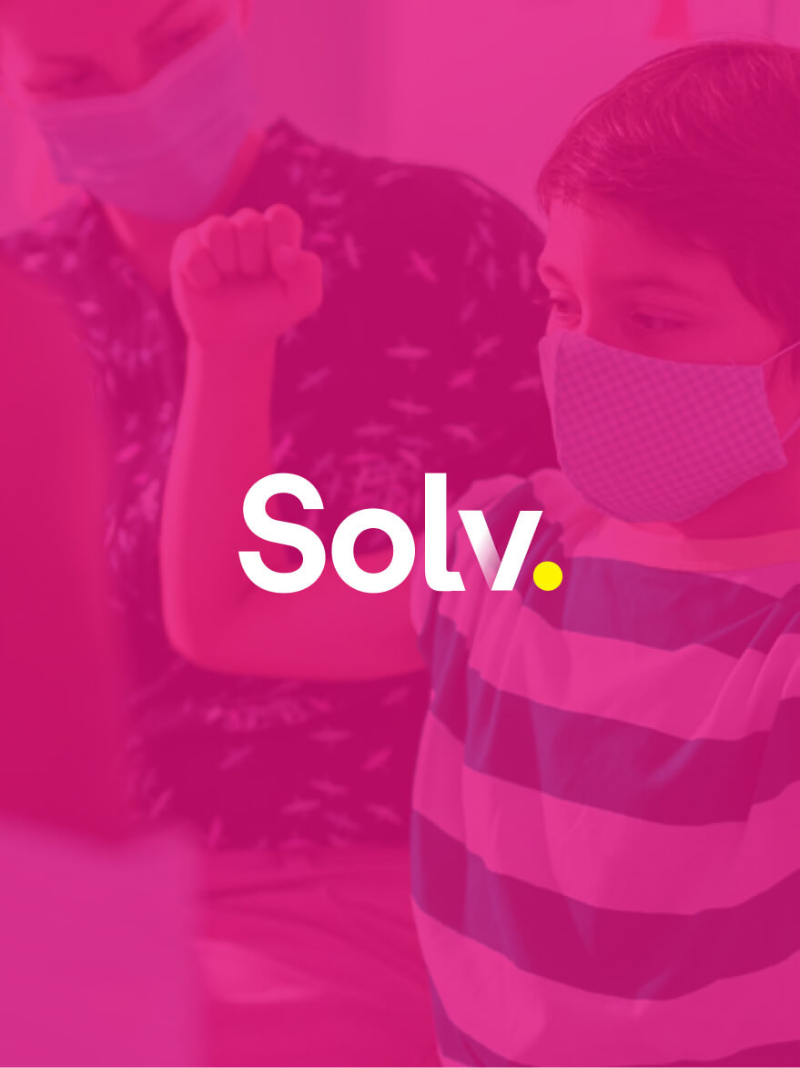 Little kid getting a doctor visit with Solv logo on top